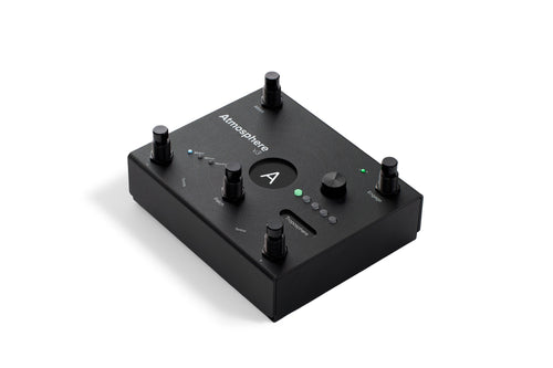 Angled view of black Atmosphere V3 pedal on white background. Shows white Atmosphere V3 branding, central A display, five black footswitches, Troposphere encoder, green LED indicators, and Major/Minor/Neutral mode lights on matte black textured surface.